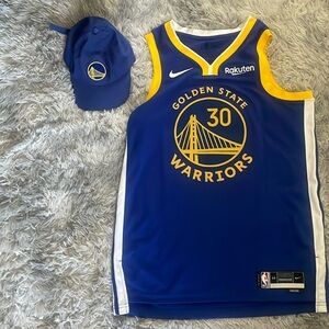 Golden State Warriors Steph Curry jersey with GSW memorabilia hat